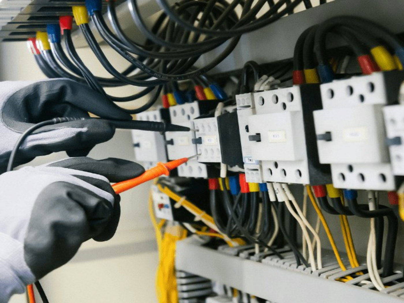 An electrician testing a distribution board